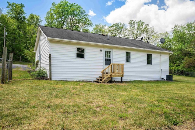 rear view of house featuring central air condition unit