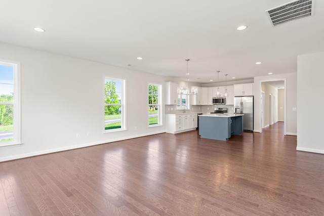 2797 Rutlege Rd Unit 197, Rockingham, VA 22801 - unfurnished living room with dark wood-style floors, baseboards, recessed lighting, and a sink