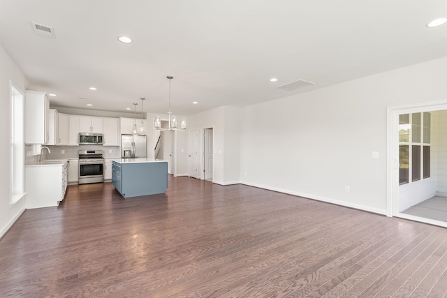 2797 Rutlege Rd Unit 197, Rockingham, VA 22801 - unfurnished living room featuring dark wood-style floors, recessed lighting, baseboards, and a chandelier