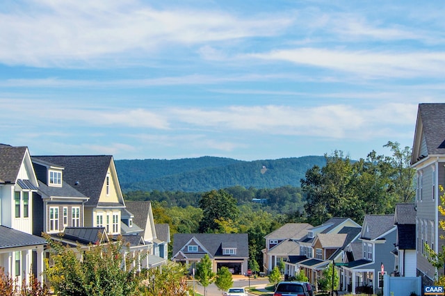 view of mountain background with nearby suburban area