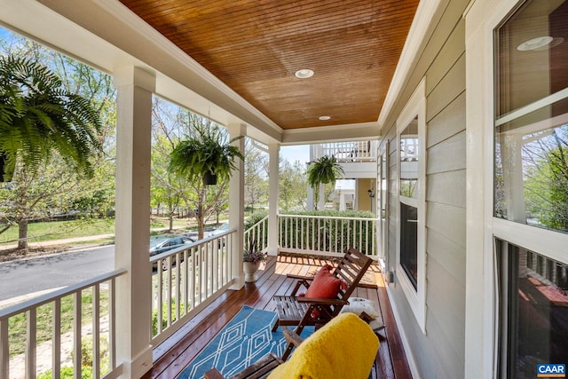 balcony featuring covered porch