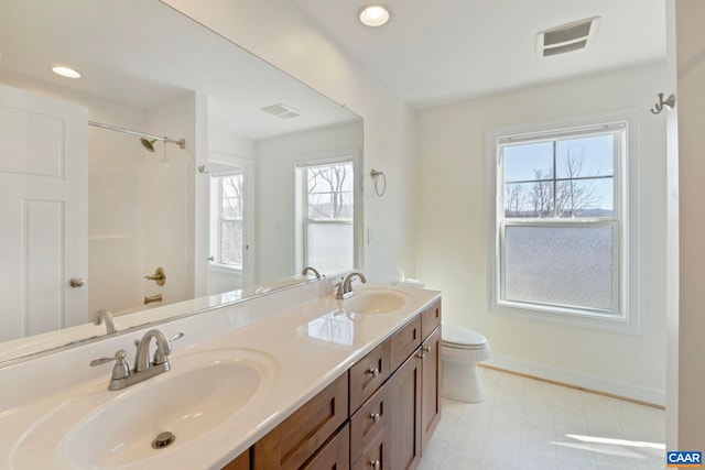1435 Butler St, Charlottesville, VA 22901 - bathroom featuring baseboards, toilet, double vanity, a shower, and recessed lighting