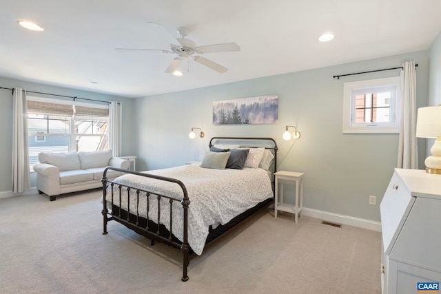 bedroom featuring light colored carpet, baseboards, ceiling fan, and recessed lighting
