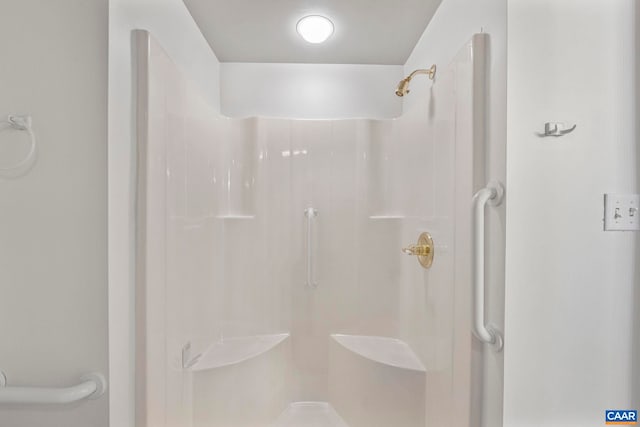 full bath with a shower stall