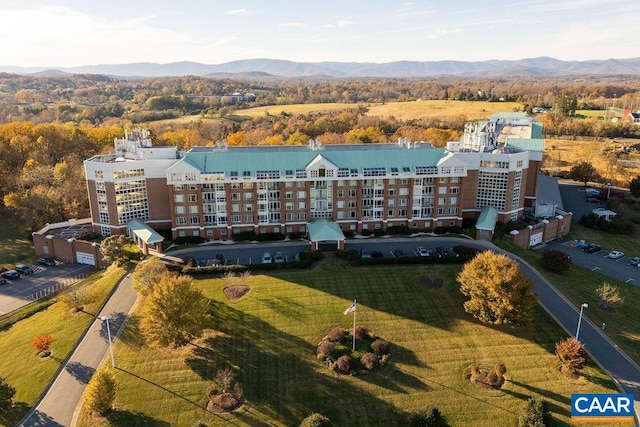 birds eye view of property featuring a mountain view