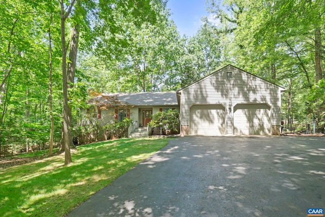 2 Whippoorwill Ln, Palmyra, VA 22963 - view of front of property with a garage, asphalt driveway, and a front lawn