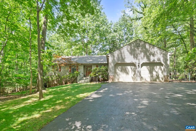 2 Whippoorwill Ln, Palmyra, VA 22963 - view of front facade with asphalt driveway, a garage, and a front lawn