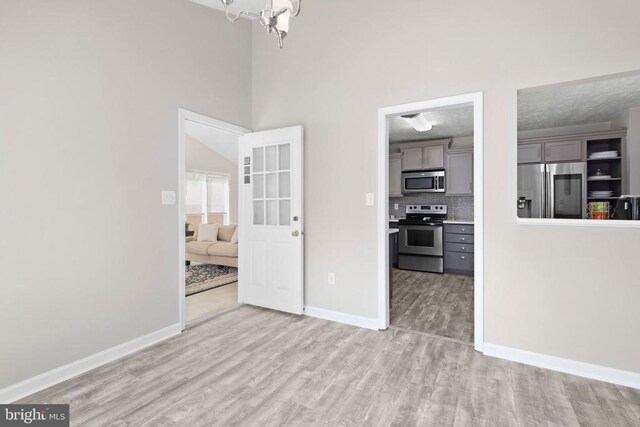 740 Lakeview Pkwy, Locust Grove, VA 22508 - unfurnished dining area featuring light wood-style flooring and baseboards
