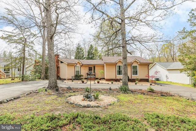 740 Lakeview Pkwy, Locust Grove, VA 22508 - ranch-style home featuring asphalt driveway, a chimney, and a shingled roof