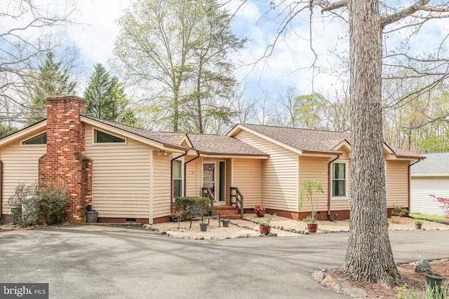 740 Lakeview Pkwy, Locust Grove, VA 22508 - view of front of house with crawl space, roof with shingles, and a chimney