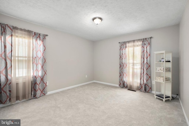 740 Lakeview Pkwy, Locust Grove, VA 22508 - spare room featuring carpet flooring, a textured ceiling, and baseboards