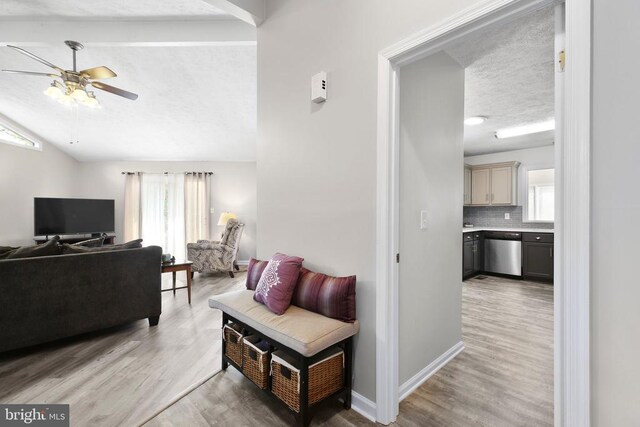740 Lakeview Pkwy, Locust Grove, VA 22508 - living room with a ceiling fan, lofted ceiling, light wood-style floors, and a textured ceiling