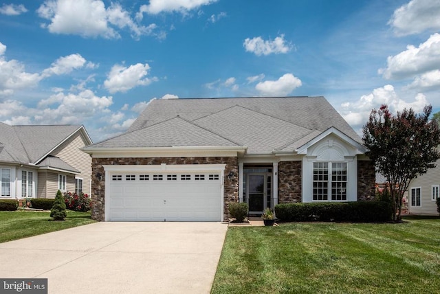 5715 Kesslers Xing W, Fredericksburg, VA 22407 - view of front of property featuring concrete driveway, a garage, stone siding, and a front yard