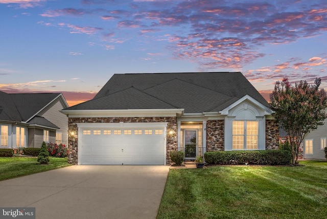 5715 Kesslers Xing W, Fredericksburg, VA 22407 - view of front of home featuring driveway, stone siding, a garage, a yard, and a shingled roof