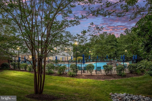 5715 Kesslers Xing W, Fredericksburg, VA 22407 - pool at dusk featuring a community pool