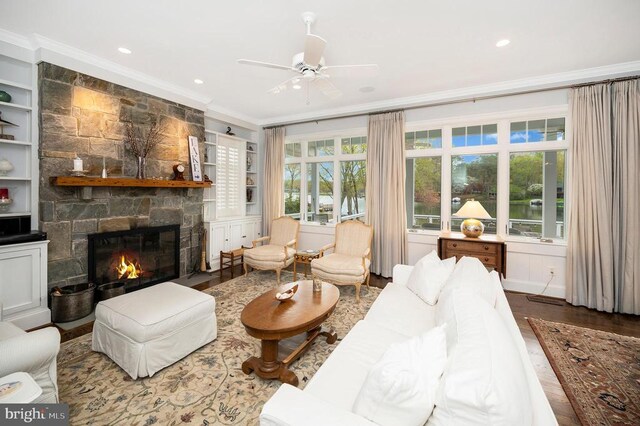 1411 Lakeview Pkwy, Locust Grove, VA 22508 - living area featuring crown molding, a fireplace, plenty of natural light, wood finished floors, and ceiling fan