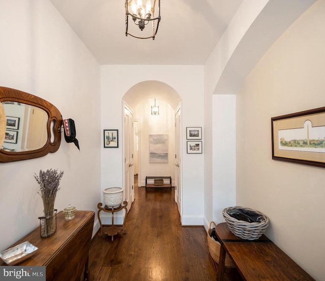 1411 Lakeview Pkwy, Locust Grove, VA 22508 - corridor featuring arched walkways, dark wood-type flooring, a chandelier, and baseboards
