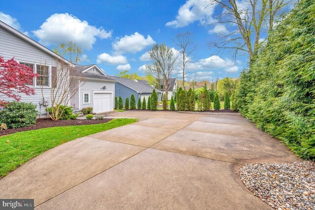 1411 Lakeview Pkwy, Locust Grove, VA 22508 - view of side of property with driveway and an attached garage