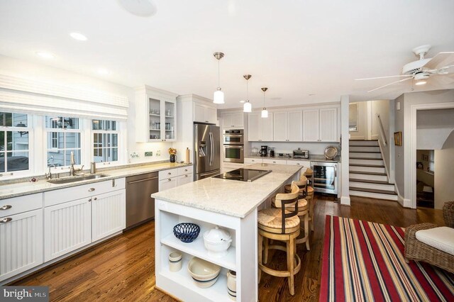 1411 Lakeview Pkwy, Locust Grove, VA 22508 - kitchen featuring beverage cooler, appliances with stainless steel finishes, a sink, dark wood-style flooring, and recessed lighting