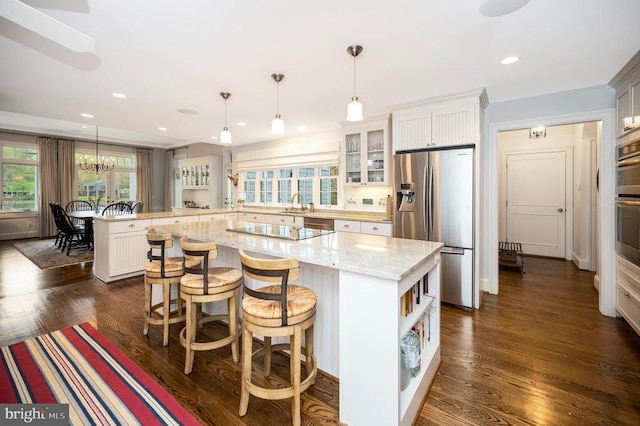 1411 Lakeview Pkwy, Locust Grove, VA 22508 - kitchen with stainless steel refrigerator with ice dispenser, a peninsula, black electric cooktop, glass insert cabinets, and a sink