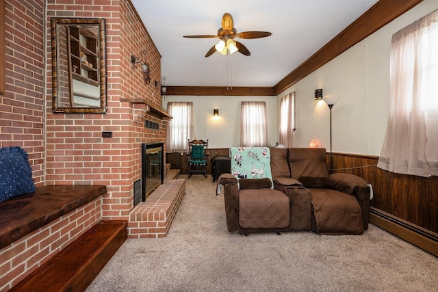 911 Old White Hill Rd, Stuarts Draft, VA 24477 - living area with carpet, a ceiling fan, a brick fireplace, wainscoting, and wood walls