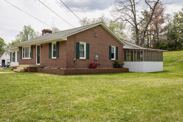911 Old White Hill Rd, Stuarts Draft, VA 24477 - view of property exterior featuring brick siding, a chimney, a yard, and a sunroom