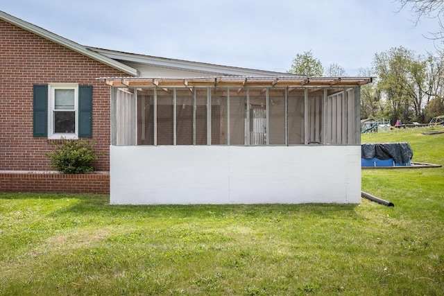 911 Old White Hill Rd, Stuarts Draft, VA 24477 - view of property exterior featuring a sunroom, a lawn, and brick siding