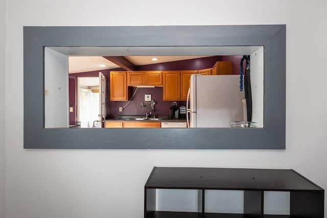 911 Old White Hill Rd, Stuarts Draft, VA 24477 - kitchen with freestanding refrigerator, a sink, a peninsula, and dark countertops