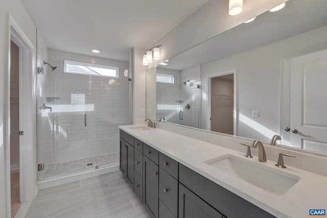 3053 Rambling Brook Ln, Crozet, VA 22932 - bathroom featuring double vanity, a shower stall, a walk in closet, tile patterned flooring, and recessed lighting