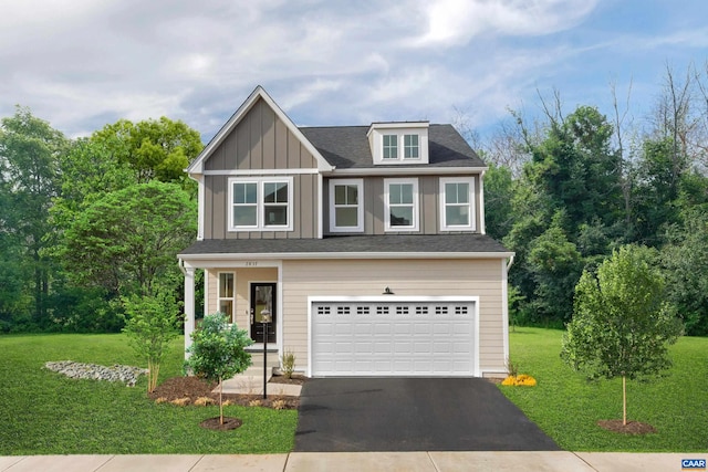 3053 Rambling Brook Ln, Crozet, VA 22932 - view of front of home featuring asphalt driveway, a garage, a front yard, and board and batten siding