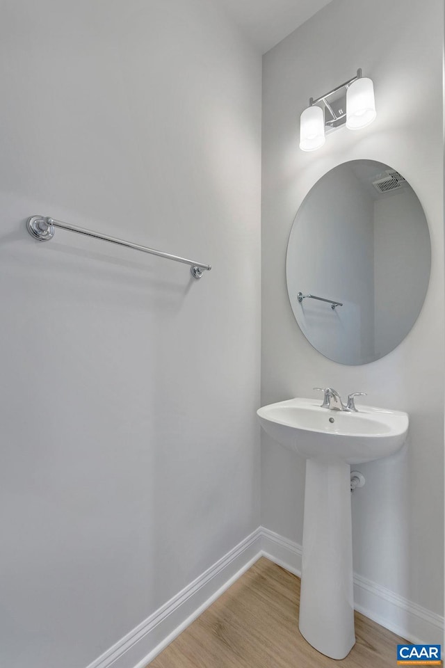 3053 Rambling Brook Ln, Crozet, VA 22932 - bathroom with wood finished floors and baseboards