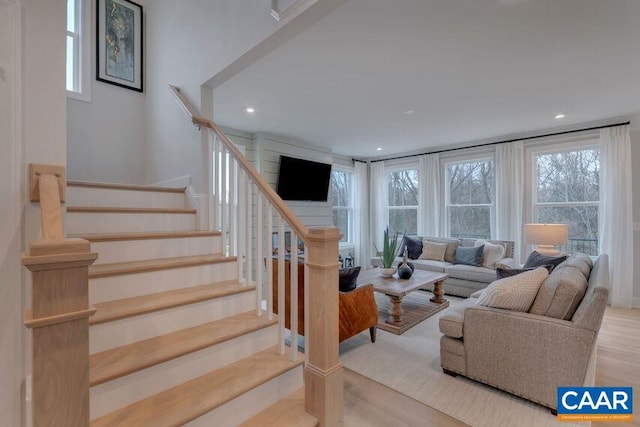 3053 Rambling Brook Ln, Crozet, VA 22932 - living room with healthy amount of natural light, wood finished floors, stairs, and recessed lighting