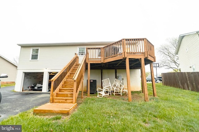 802 Shamrock Dr, Fredericksburg, VA 22407 - rear view of property featuring an attached garage, cooling unit, a deck, aphalt driveway, and stairway