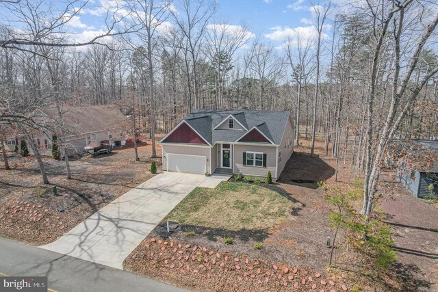 208 Yorktown Blvd, Locust Grove, VA 22508 - view of front facade featuring concrete driveway, a garage, and roof with shingles
