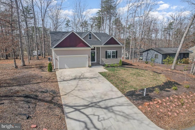 208 Yorktown Blvd, Locust Grove, VA 22508 - craftsman-style house with concrete driveway, an attached garage, and a shingled roof