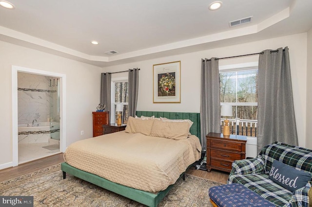 208 Yorktown Blvd, Locust Grove, VA 22508 - bedroom featuring a raised ceiling, wood finished floors, recessed lighting, and ensuite bathroom