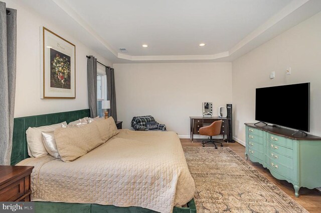 208 Yorktown Blvd, Locust Grove, VA 22508 - bedroom featuring wood finished floors, a raised ceiling, and recessed lighting