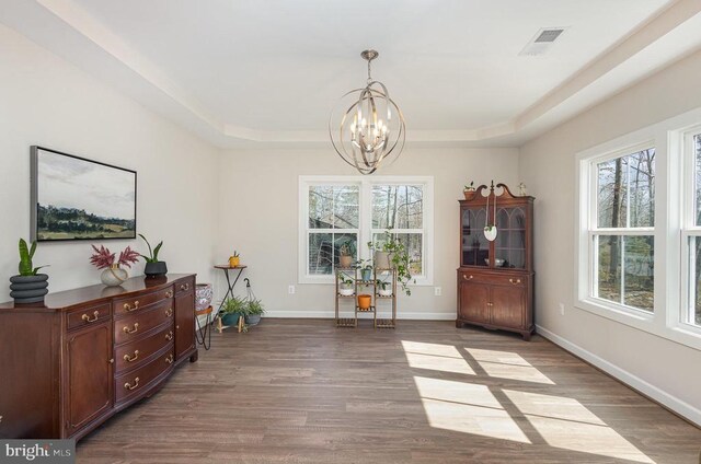 208 Yorktown Blvd, Locust Grove, VA 22508 - dining room featuring a chandelier, healthy amount of natural light, wood finished floors, and a raised ceiling