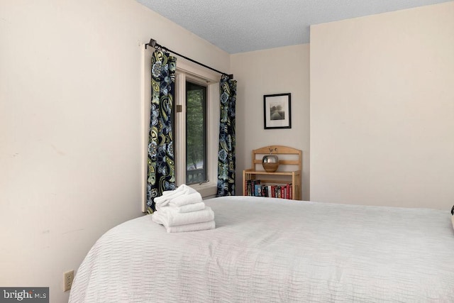 bedroom featuring a textured ceiling