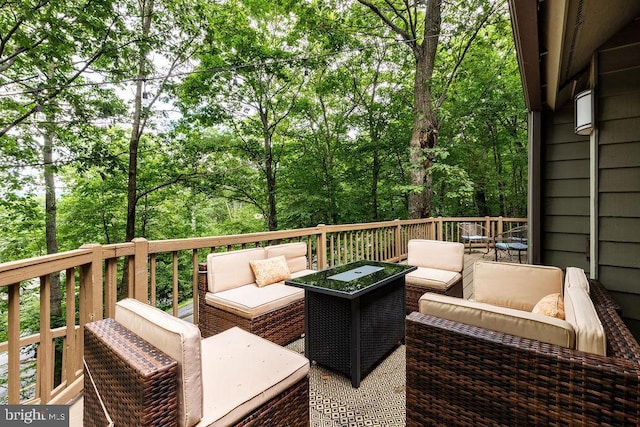 wooden deck featuring an outdoor living space