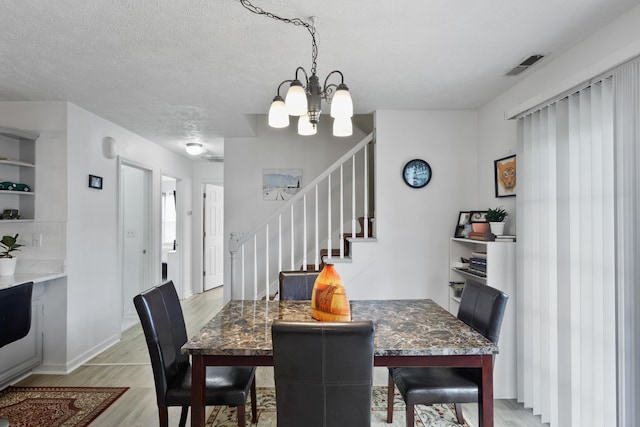 200 Kingsport Rd, Waynesboro, VA 22980 - dining room with a chandelier, stairs, and light wood-type flooring