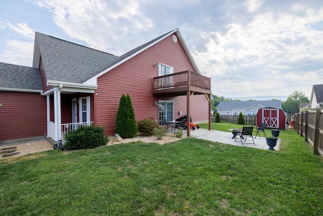 200 Kingsport Rd, Waynesboro, VA 22980 - rear view of house featuring a shingled roof, a shed, a fenced backyard, a patio, and a balcony