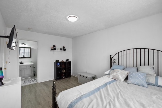 200 Kingsport Rd, Waynesboro, VA 22980 - bedroom with wood finished floors, a textured ceiling, and ensuite bath