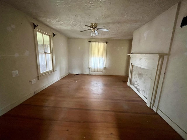 1201 Burnett St, Staunton, VA 24401 - unfurnished living room with baseboards, ceiling fan, a textured ceiling, and wood finished floors