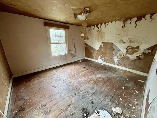 1201 Burnett St, Staunton, VA 24401 - empty room featuring baseboards and hardwood / wood-style floors