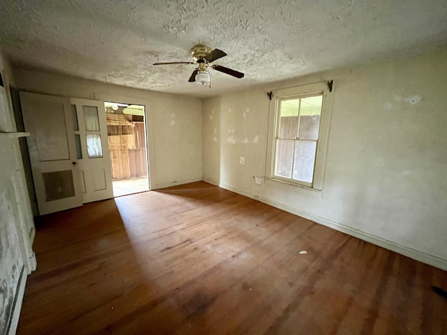 1201 Burnett St, Staunton, VA 24401 - unfurnished room featuring baseboards, ceiling fan, a textured ceiling, and wood finished floors