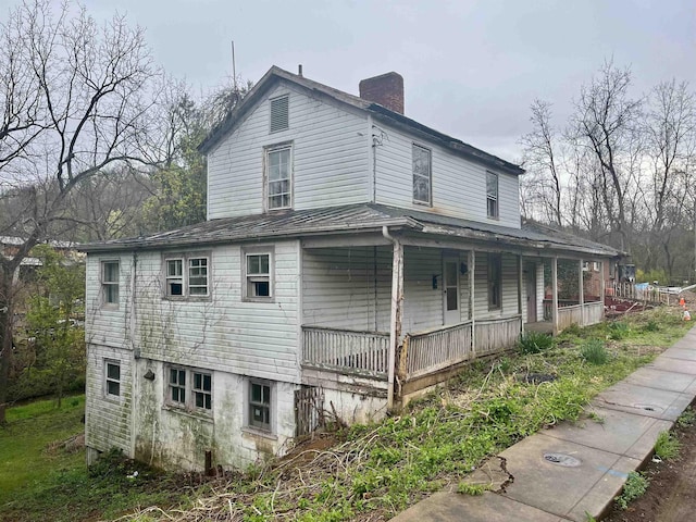 1201 Burnett St, Staunton, VA 24401 - view of property exterior with covered porch and a chimney