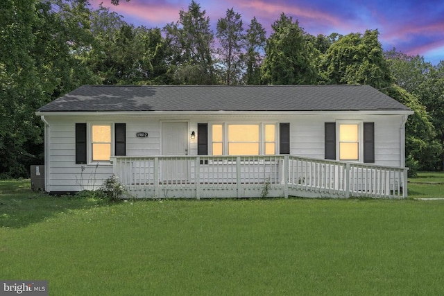 19012 Lahore Rd, Orange, VA 22960 - ranch-style house featuring a front yard, a porch, a shingled roof, and view of scattered trees