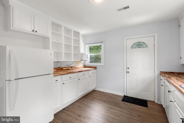 19012 Lahore Rd, Orange, VA 22960 - kitchen with freestanding refrigerator, butcher block countertops, open shelves, dark wood-style floors, and white cabinetry
