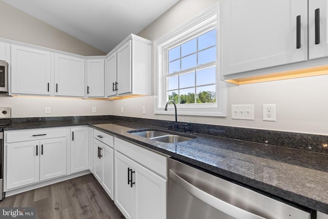 2434 Repton Mill Rd, Aroda, VA 22709 - kitchen with a sink, stainless steel dishwasher, vaulted ceiling, white cabinetry, and dark stone counters